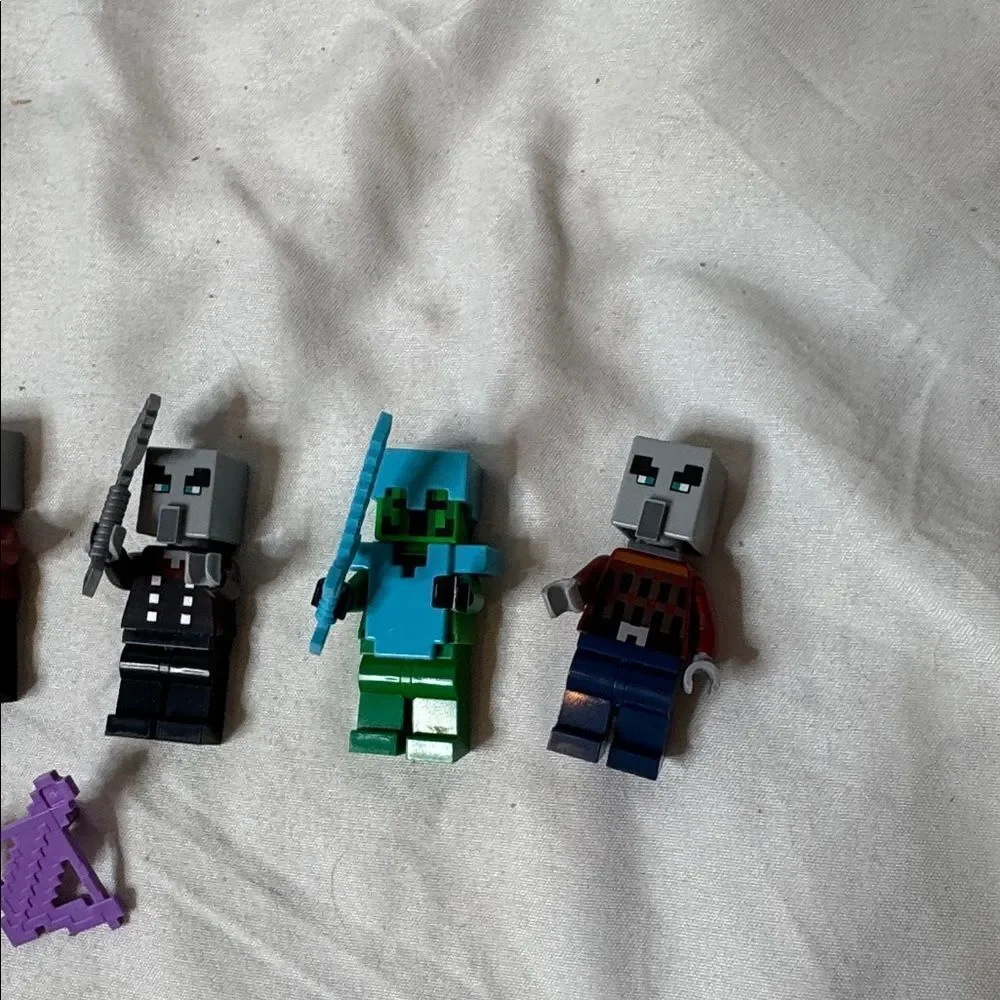 Set of Four Lego Minecraft Miniature Figures with Accessories.